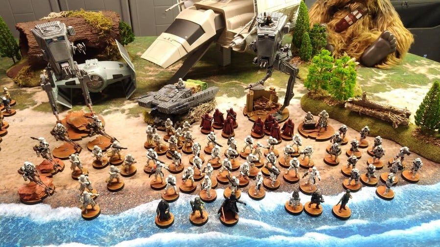 Table de jeu de figurines avec décors et armées déployées